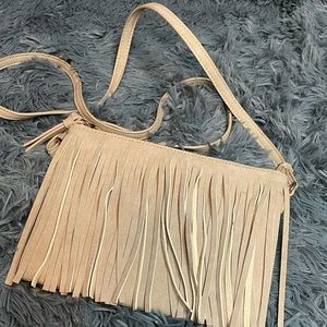 Beige cross body tassel front purse